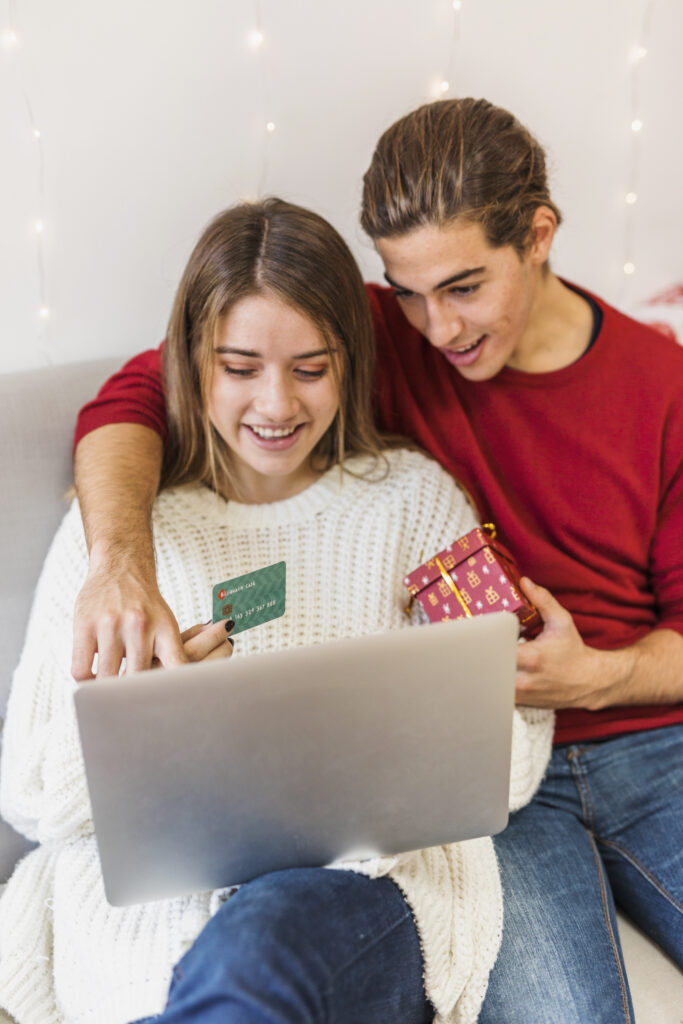 man showing laptop screen with finger